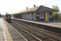 A view west at St Helens Junction on 19 April 2014 with a Liverpool bound service departing.<br><br>[John McIntyre 19/04/2014]