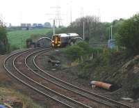 Approaching Bargeddie station, 158702 crosses the Cutty Sark bridge  on 28th April 2014.<br><br>[Colin McDonald 28/04/2014]