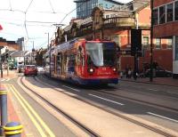 Supertram no 122 runs along West Street, Sheffield, on 29 April 2014.<br><br>[Bruce McCartney 29/04/2014]