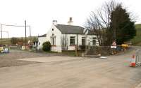 The old station building at Heriot looking north from the site of the level crossing on 13 April 2014. The down platform has long gone although the staggered up platform is still in place behind the camera. An excavating machine stands in the background in the area once occupied by the goods yard. [See image 47172]<br><br>[John Furnevel 13/04/2014]