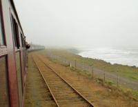 <I>The Wansbeck</I> steam railtour standing at North Blyth during a particularly foul spell of North Sea weather. This view looks north towards K1 62005 which was about to take the train back to Newcastle (and later the Boulby line) with B1 61264 bringing up the rear. [See image 46839] for the view in the opposite direction at this point of the tour. <br><br>[Malcolm Chattwood 29/03/2014]