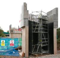 The new rail bridge over Wheatlands Road, Galashiels, taking shape on 3 May 2014. View is south, with the road bridge carrying Plumtreehall Brae visible in the left background on the other side of the Gala Water. <br><br>[John Furnevel 03/05/2014]