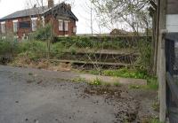 The abandoned platforms on the north side of Patricroft station, looking across Green Lane towards the Queen's Arms on 19 April 2014. [Ref query 6548]<br><br>[John McIntyre 19/04/2014]