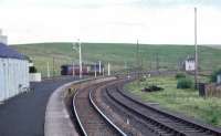 Looking towards Riccarton South box from the platform at Riccarton Junction on a summer Sunday in 1968, a day on which the Waverley route was handling traffic diverted from the WCML due to engineering works. The Brush type 4 with the single vehicle in the background is D1958.<br><br>[D Walker Collection [Courtesy Bruce McCartney] //1968]