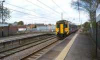 A limited stop Manchester Oxford Road to Liverpool Lime Street service arrives at Newton-le-Willows on 19 April 2014. On the left behind the platform fence is the loading ramp for the old Motorail terminal. [With thanks to Michael Butterworth]<br><br>[John McIntyre 19/04/2014]