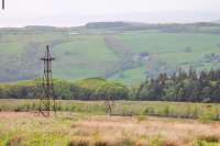 <I>Disused Ropeway</I>. Until the 1990s there were two aerial ropeways that gradually diverged from Claughton Moor clay pit down to brickworks in Claughton itself. Nothing remains of the closed southerly ropeway in the village but high on the moor some old pylons still mark the route. This view looks towards the Lune Valley from Claughton Moor with Morecambe Bay beyond.<br><br>[Mark Bartlett 09/05/2014]