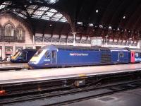 First production build HST power car 43002 at the town end of Paddington platform 4 in August 2013. Sister unit 43180, built towards the end of the HST programme, is standing over in platform 2.   <br><br>[David Pesterfield 01/08/2013]