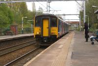 A Manchester Victoria to Liverpool Lime Street service calls at Eccles on 19 April 2014. With electrification now complete between Castlefield Jct and Parkside Jct the line is used daily by TransPennine services between Manchester Airport and Edinburgh or Glasgow using the new Class 350/4 EMUs.<br><br>[John McIntyre 19/04/2014]