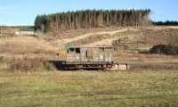 The <I>Shark</I> ballast brake van in the old Border Counties bay at Riccarton in 2007 is BR 993827. The vehicle was built by BRCW in 1956 and placed here by the Friends of Riccarton Junction. The (much modified) brake van is now at Bardney Heritage Centre, Lincs, where it serves Fish & Chips as <I>The Bardney Fryer</I>.  <br><br>[John Furnevel 07/11/2007]