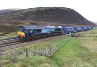 DRS 66430 starts the descent into Druimuachdar Pass on 10 May with the southbound Stobart Rail containers.<br><br>[John Gray 10/05/2014]