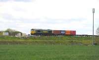 Freightliner 66571 eastbound near Bourton on the eastern outskirts of Swindon on 13 May.<br>
 <br>
<br><br>[Peter Todd 13/05/2014]