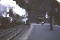 Trains waiting to leave St Enoch station on 22 March 1965. Locomotives from left to right are 70001, 44791, 80086 and 44792.  <br><br>[John Robin 22/03/1965]