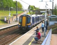 Girl with a goldfish. The 12.50 Dunbar - Edinburgh makes its only intermediate stop at Musselburgh on 13 May 2014. The scheduled journey time from here to Waverley is 7 minutes. Glug.<br><br>[John Furnevel 13/05/2014]