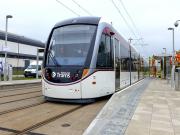 Edinburgh tram 266 stops for lunch at Bankhead on 20 May 2014, while work continues in preparation for the commencement of public services in 11 days time.<br><br>[Bill Roberton 20/05/2014]