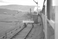 Having just passed through Garsdale station on 9 July 1961, <I>The Borders Rail Tour</I> runs onto Moorcock Viaduct. On the front of the train is 46247 <I>City of Liverpool</I>, which took the special as far as Petterill Bridge Junction, Carlisle, before handing over to a pair of B1s for the next leg to Hawick. [See image 33252]<br><br>[K A Gray 09/07/1961]