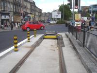 The city end of the present Edinburgh Tram network finishes at this simple stop block located at the eastern end of York Place, by Broughton Street junction, as seen in this view towards Leith Walk on 21 May 2014. <br><br>[David Pesterfield 21/05/2014]
