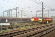 Looking east across Wembley Yard from Sudbury Junction on a very wet evening on 10 May 2014 with DBS 92031 and 90020 stabled in the loco sidings.<br><br>[John McIntyre 10/05/2014]