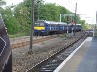 Ex Scotrail 322483 departs from Wakefield Westgate on 21 May as the 08.25 to Leeds, ex Doncaster, whilst CrossCountry Voyager 220008 sets out on the 08.23 service for Plymouth. In the background 2 car 155346 is laying over in the former Wrenthorpe Yard before returning to Huddersfield at 08.44.<br><br>[David Pesterfield 21/05/2014]