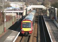 Scene at Cumbernauld in February 2005 as an SPT liveried 170 DMU arrives at platform 2 with a service from Glasgow Queen Street.<br><br>[John Furnevel 26/02/2005]