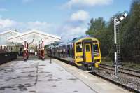 Unit 158901 is beckoned on by the up starter signal as it pulls away from the Hellifield stop on 24 April while working the 08:53 Carlisle to Leeds service.<br><br>[Bill Jamieson 24/04/2014]