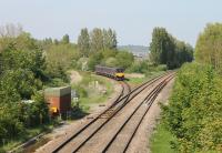 A Taunton to Bristol local service swings left onto the Weston-super-Mare loop at Uphill Junction. 150121 is one of two three-car sets operated by First Great Western in 2014.<br><br>[Mark Bartlett 18/05/2014]