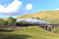 Black Fives Nos.44871 and 45407 bring <I>The Cathedrals Explorer</I> off the viaduct at Auchtertyre, between Crianlarich and Tyndrum, on 14 May on the way to Fort William. [Ref query 9489]<br><br>[John Gray 14/05/2014]