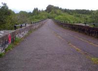 Long, tall, and narrow: looking East along the deck of Lambley Viaduct [see image 47432] on a blustery day. Notice the plaque on the left marking the structure as a Transport Heritage Site.<br><br>[Ken Strachan 22/05/2014]