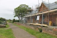 The former station at Yarmouth (Isle of Wight) on the Freshwater, Yarmouth and Newport Railway. The station closed in 1953 and was later used as a youth club. View along what is now a cycle path towards Freshwater on 20 May 2014. [Ref query 4406]<br><br>[Mark Bartlett 20/05/2014]