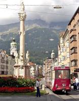 IVB tram No. 31 on route 3 passing St. Anna's column on Innsbruck's Maria-Theresien-Strasse in September 2005. Although W A Mozart appears to be driving, he is in fact advertising his chocolate covered balls (Mozartkugeln) - each to his own I suppose!		                         <br><br>[Bill Jamieson 12/09/2005]