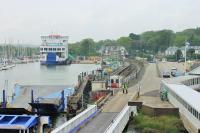 Lymington Pier station, as seen from the ferry <I>Wight Sky</I> arriving from Yarmouth. The ferries no longer berth alongside the rail station [See image 33517] but it is still only a very short walk from the ship to the platform. Spare ferry <I>Wight Sun</I> is moored beyond the station, near the rail bridge. <br><br>[Mark Bartlett 20/05/2014]