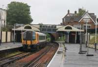 A Waterloo to Weymouth service, formed by SWT 444005, calls at Branksome, between Bournemouth and Poole, on a very wet morning in May 2014. <br><br>[Mark Bartlett 23/05/2014]