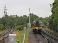 SWT 444036 leaves Hamworthy heading for Wareham and Weymouth on 23 May. As the EMU bears right the Hamworthy Goods branch, presently out of use, can be seen curving left down towards Poole Harbour [See image 47654]. <br><br>[Mark Bartlett 23/05/2014]