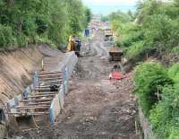 The Waverley route between Eskbank and Hardengreen looking south on 2 June 2014. Note the supports for the footbridge that will span the trackbed in the background at the site of the new Eskbank station.<br><br>[John Furnevel 02/06/2014]