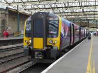 TransPennine 350403 pauses at Carlisle on 29 May with the 10.08 Edinburgh - Manchester Airport service.<br><br>[Bill Roberton 29/05/2014]