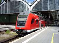 A Hamburg bound service emerges into the warm afternoon sun at Lubeck on 30 May 2014.<br><br>[John Steven 30/05/2014]