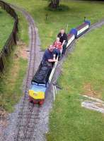 The Fancott Railway (near Dunstable) claims to be the only pub railway in Britain. The driver and passengers all seem to be having fun in this view from the footbridge on 30 May. The pub and sole station stand beyond the top left corner of this picture.<br><br>[Ken Strachan 30/05/2014]