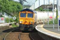 GBRf 66733 brings the North Blyth to Fort William alumina tank wagons through Cardross on a sunny Saturday afternoon on 31 May 2014.<br><br>[John McIntyre 31/05/2014]