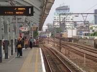 Looking West along the DLR platforms at Shadwell towards Bank on 26 May 2014. The LTS lines from Fenchurch Street are on the right.<br><br>[John Thorn 26/05/2014]