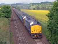 DRS 37419+37423 climb away from Inverkeithing East Junction towards Dalgety Bay on 30 May with Compass Tours <I>The Forth and Tay Highlander</I> from Crewe to Inverness.<br><br>[Bill Roberton 30/05/2014]