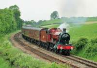 5972 <I>Hogwarts Castle</I>, rarely ventures out from Carnforth but headed the <I>Wizards Express</I> to York on 7th June 2014. The loco is due to go on static display for several years at Harry Potter World and this <I>last trip</I> sold out very quickly and so is being repeated in July. 5972, real name <I>Olton Hall</I>, is seen at Borwick heading east towards Settle Junction. <br><br>[Mark Bartlett 07/06/2014]