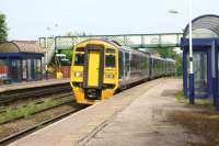 Northern 158754 passes through Rishton non-stop on a York to Blackpool service on 6 June 2014.<br><br>[John McIntyre 06/06/2014]