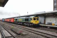 A joy to behold at 0530 on a wet Saturday morning in Swindon Station. <br>
Freightliner 66587 restarts a westbound container train following a crew change.<br><br>[Peter Todd 07/06/2014]