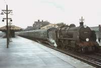 Maunsell U class 2-6-0 no 31639 calls at Basingstoke in August 1964 with a local train. <br><br>[John Robin 24/08/1964]