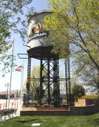 Standing  between the railroad tracks and Tehachapi main street, the Southern Pacific water tower with the closed Depot beyond. Built to water the locomotives battling the gradients through the Tehachapi Pass on the line between Bakersfield and Mojave in the Californian high desert.<br><br>[Brian Taylor 15/04/2014]