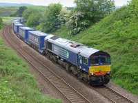 DRS 66301 with the 4D47 Inverness - Mossend intermodal, diverted through Fife due to engineering works in the Larbert area on 1 June, seen here at the former Cowdenbeath North Junction.<br><br>[Bill Roberton 01/06/2014]