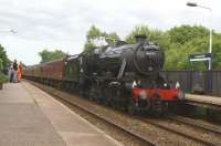 11 June 2014 was the first Wednesday of the 2014 season for the weekly <I>Fellsman</I> railtour from Lancaster to Carlisle via the S&C. Doing the honours on the first outing was Stanier 8F 2-8-0 no. 48151, seen here on the return trip passing through Lostock Hall station.<br><br>[John McIntyre 11/06/2014]