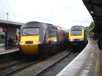 CrossCountry HST power car 43207 leaves Bristol Parkway Platform 3 on the rear of the 14.40 to Glasgow, just as the 14.41 First Great Western HST to Cardiff arrives at platform 2.<br><br>[David Pesterfield 04/06/2014]