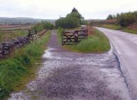 View East, towards Lambley, on the 1852 extension [see image 5724] which came 12 years too late to see operational use of Stephensons Rocket! A very oblique crossing of the A689, and some very damp weather. Appearances are deceptive - the foot/cycle path runs out less than half a mile ahead of this viewpoint.<br><br>[Ken Strachan 22/05/2014]