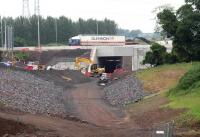 Normal service resumed at Sheriffhall. View north on 13 June as a lorry heads east along the restored section of the original route following completion of the bridge works.  Just beyond, work is currently underway on removing the temporary diversion which was brought into use last September. [See image 44347] <br><br>[John Furnevel 13/06/2014]