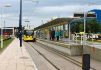 An addition to the Manchester Metrolink network in 2013 was Ashton-under-Lyne. The East Manchester line has been extended from the temporary terminus at Droylsden on a route that uses or closely follows the main road. This is the terminus, which is part of a transport interchange. The bus station is adjacent and the railway station close by. Tram 3072 waits to leave for Eccles via Piccadilly. <br><br>[Mark Bartlett 09/06/2014]